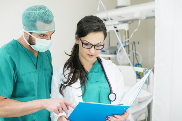 Medical team workers examining a medical report